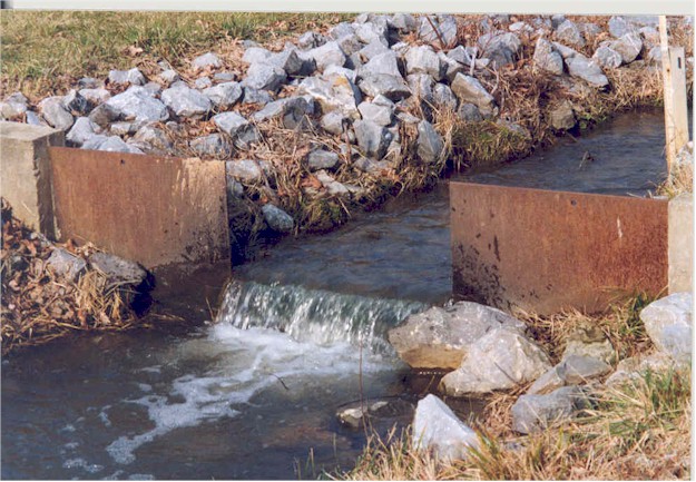 A stream of water passing through gates for water monitoring