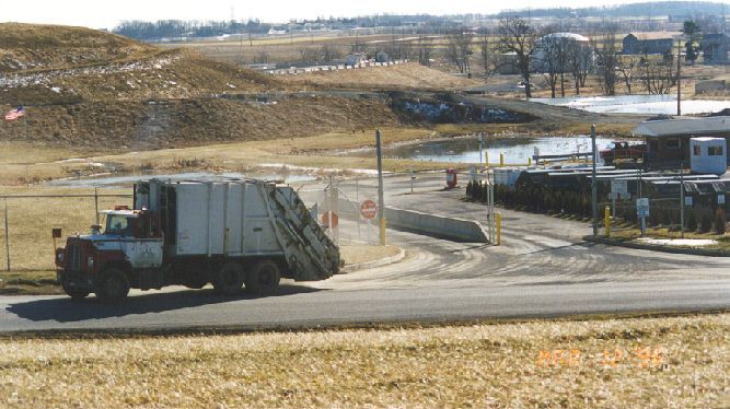 A dump truck leaving a facility